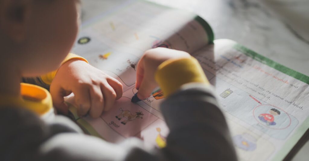 Young child coloring in a workbook, illustrating focus on early childhood education.